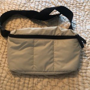 Calpak Luka belt bag. Ivory/cream with black strap. Listed as Dove gray.